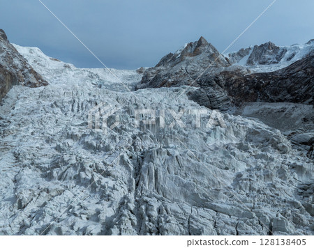 Beautiful high altitude glacier and snow capped mountain with lake in Tibet, China 128138405