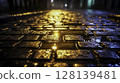 Glowing Cobblestones in Rain with Reflections of Soft Street Lights at Night 128139481