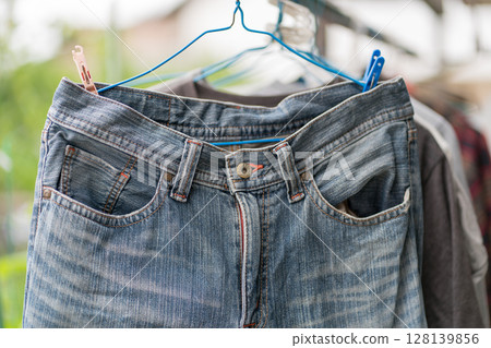 Washing jeans in the rainy season Washing jeans in the rainy season 128139856