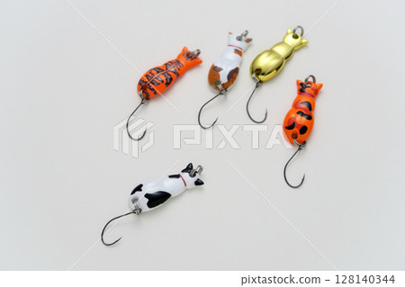 A cute and colorful cat-shaped spoon lure for fishing A cute and colorful cat-shaped spoon lure for fishing 128140344