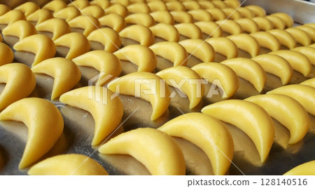 Soft and buttery putri salju cookies coated in powdered sugar, offering a melt-in-your-mouth texture with a sweet and nutty flavor. A classic Indonesian treat for special occasions. 128140516