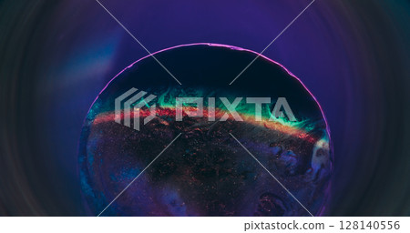 Ink spill. Colorful blend. Blur red purple neon round texture flowing blue droplets shimmer water floating on abstract dark black background. 128140556