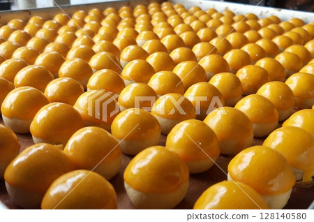 Pineapple cake, called Kue Nenas or Nastar in Indonesian, is one of the most popular traditional sweets to celebrate Eid al-Fitr. Indonesian people's favorite sweets. Selective focus. Pineapple cake, called Kue Nenas or Nastar in Indonesian, is one of the most popular traditional sweets to celebrate Eid al-Fitr. Indonesian people's favorite sweets. Selective focus. 128140580