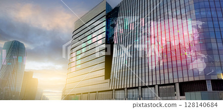 Modern corporate headquarters office with glass facade reflecting digital world map. Global business network, technology leadership, and international corporate success. Worldwide economic growth. 128140684