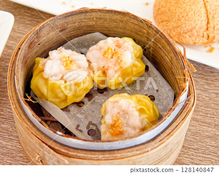 Shrimp and Fish Roe Siu Mai, Juicy shrimp, topped with fish roe 128140847