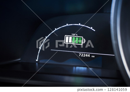 Electric vehicle dashboard showing a 100% battery fully charge. EV, green energy 128141059