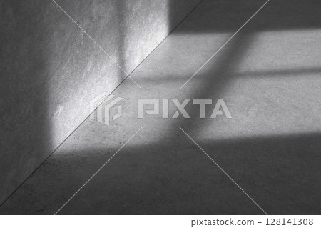 Concrete background that can be used in various designs with shadows of sunlight through the window. Concrete background that can be used in various designs with shadows of sunlight through the window. 128141308