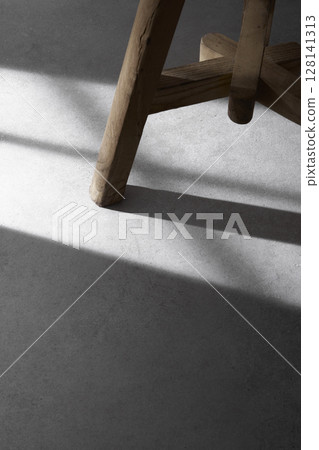 Concrete background that can be used in various designs with shadows of sunlight through the window. Concrete background that can be used in various designs with shadows of sunlight through the window. 128141313