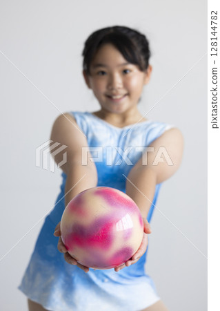 Elementary school students enjoying rhythmic gymnastics 128144782