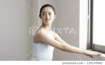 Cute woman learning ballet Cute woman learning ballet 128145062