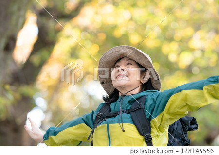 Hiking, Autumn, Yellow leaves, Deep breath, Stretching Hiking, Autumn, Yellow leaves, Deep breath, Stretching 128145556