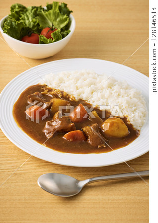Delicious curry rice served on a plate 128146513