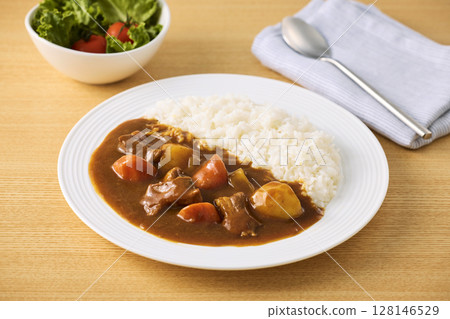 Delicious curry rice served on a plate Delicious curry rice served on a plate 128146529
