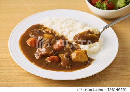 Delicious curry rice served on a plate Delicious curry rice served on a plate 128146561