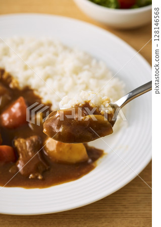 Delicious curry rice served on a plate Delicious curry rice served on a plate 128146568