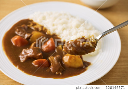 Delicious curry rice served on a plate Delicious curry rice served on a plate 128146571