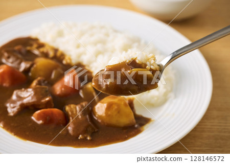 Delicious curry rice served on a plate 128146572