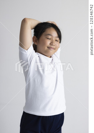 Elementary school student wearing gym suit 128146742