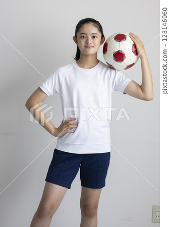 Child with a soccer ball 128146960