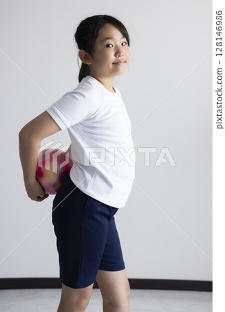 Elementary school students enjoying rhythmic gymnastics 128146986