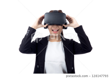 Portrait young asian businesswoman wearing headset virtual reality for device with experience. 128147793
