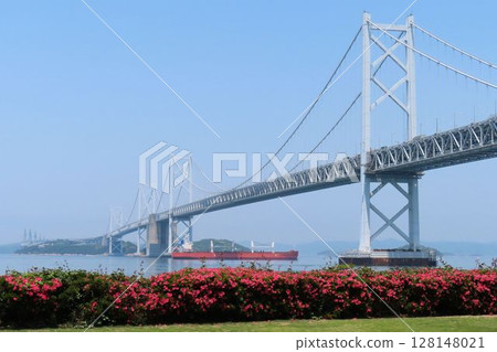 A view of the Great Seto Bridge on the Kagawa side and a cargo ship passing underneath it 128148021