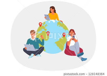 Team of business people works remotely from different countries, sitting with gadgets near globe 128148364