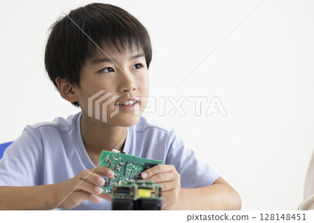 Elementary school students using tablets 128148451
