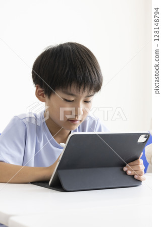 Elementary school students using tablets 128148794