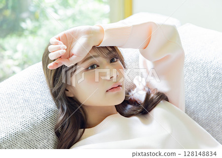 A woman relaxing on the sofa 128148834