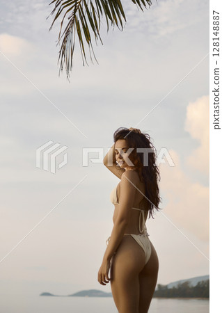 Beautiful body woman on the beach. Sexy girl in Bikini at sunset time 128148887