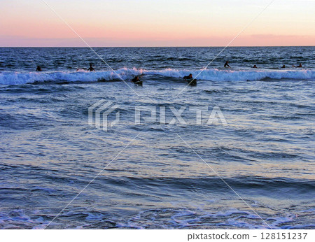 Surfers on Costa Mesa Coast, Southern California, USA Surfers on Costa Mesa Coast, Southern California, USA 128151237