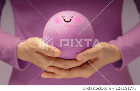 Hands gently holding Smiling Circle face. Mental health, emotional balance,inner peace through meditation and mindfulness. symbolizing good mental and self-awareness Hands gently holding Smiling Circle face. Mental health, emotional balance,inner peace through meditation and mindfulness. symbolizing good mental and self-awareness 128151775