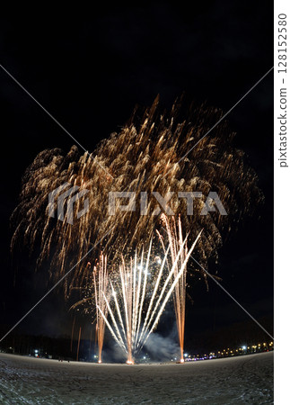 Fireworks launched from the snow in a park in Hokkaido with the moon, Venus, and Saturn in the background Fireworks launched from the snow in a park in Hokkaido with the moon, Venus, and Saturn in the background 128152580