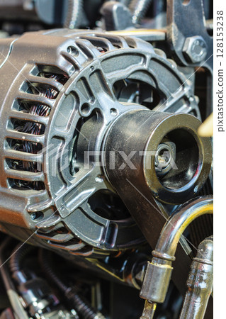 Detailed closeup of alternator generator machine engine Detailed closeup of alternator generator machine engine 128153238
