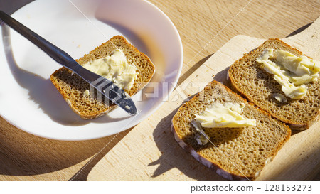 Breakfast. Rye bread slices with butter Breakfast. Rye bread slices with butter 128153273