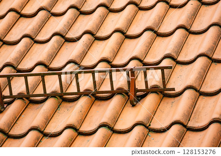 Tiles roof with snow guards safety. Tiles roof with snow guards safety. 128153276