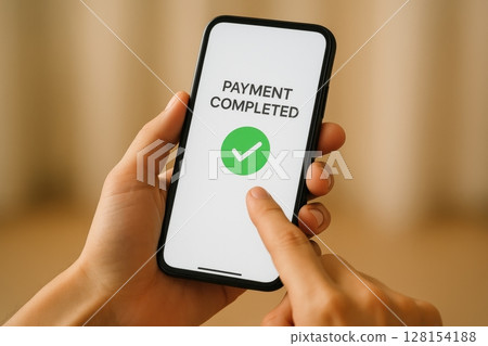 Hand holding smartphone with Payment Completed 128154188