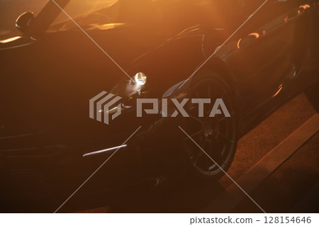 A shiny black convertible 128154646