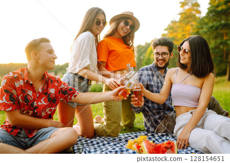 Happy groop of friend resting in nature in picnic. People, lifestyle, relaxation, vacations concept. 128154651