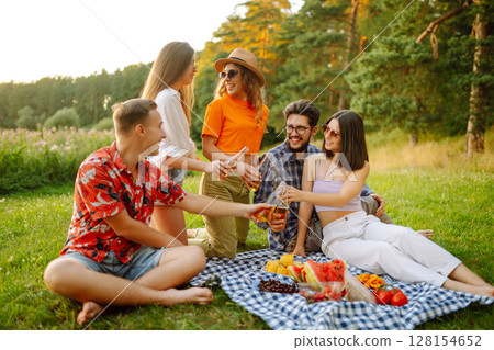 Happy groop of friend resting in nature in picnic. People, lifestyle, relaxation, vacations concept. Happy groop of friend resting in nature in picnic. People, lifestyle, relaxation, vacations concept. 128154652