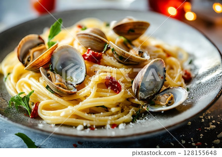 Delicious Clams and Spaghetti Dish; Close-up of Gourmet Pasta with Shellfish. 128155648