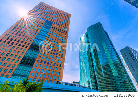 Tokyo cityscape, Japan, July 4th. View of Shiodome business district and Yurikamome line. 128155906