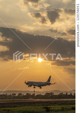 Sendai Airport at dusk, airplane landing, Natori City, Miyagi Prefecture Sendai Airport at dusk, airplane landing, Natori City, Miyagi Prefecture 128156051
