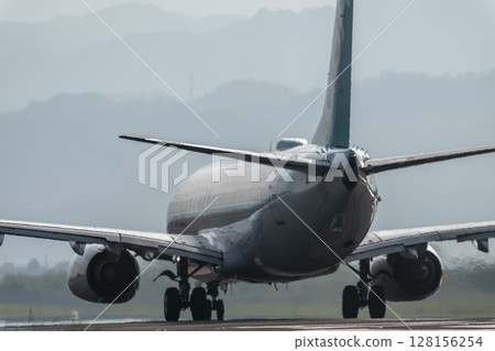 Sendai Airport at dusk, airplane taking off, Natori City, Miyagi Prefecture 128156254