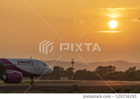 Sendai Airport at dusk, plane taxiing, Natori City, Miyagi Prefecture 128156285