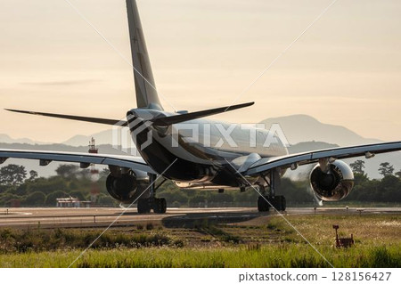 Sendai Airport at dusk, airplane taking off, Natori City, Miyagi Prefecture 128156427