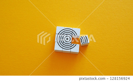 Puzzle forming a target symbolizing strategic focus and goal achievement. 128156924