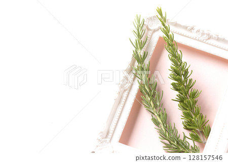 Picture frame and rosemary leaves 128157546