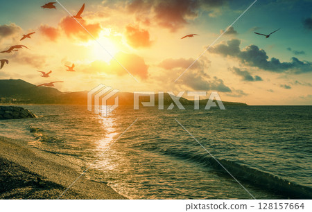 Sunset over the beach. Cote dAzur. Nice, France, Europe Sunset over the beach. Cote dAzur. Nice, France, Europe 128157664